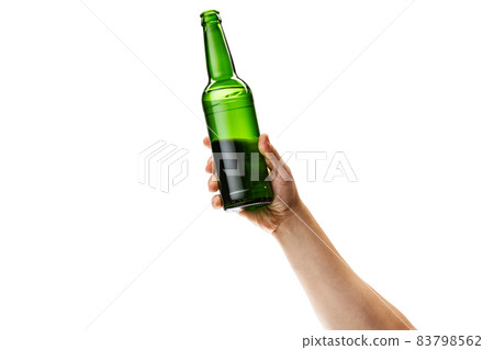 Cropped image of male hand holding bottle of lager beer isolated over white background Cropped image of male hand holding bottle of lager beer isolated over white background 83798562