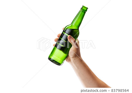 Cropped image of male hand holding bottle of lager beer isolated over white background Cropped image of male hand holding bottle of lager beer isolated over white background 83798564