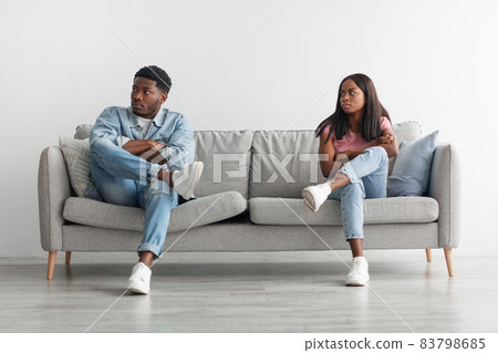 Young black couple having fight, ignoring each other Young black couple having fight, ignoring each other 83798685