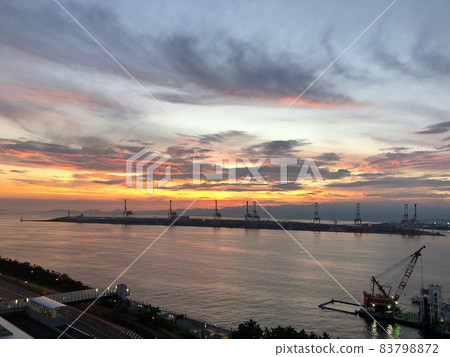 Harbor container and sunset 83798872