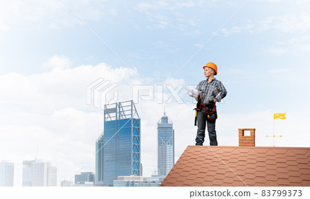 Builder in hardhat with technical blueprints 83799373