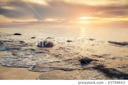Golden sunset over beach in Miedzyzdroje, Poland. 83799643