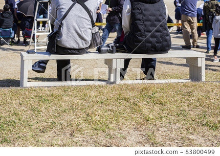 Parents taking a break at the athletic meet 83800499