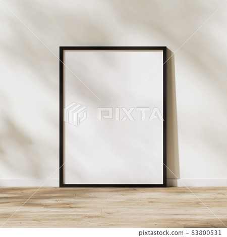 blank vertical black frame mock up, poster frame on wooden floor with sunlight with leaves shadow on white wall, 3d rendering blank vertical black frame mock up, poster frame on wooden floor with sunlight with leaves shadow on white wall, 3d rendering 83800531