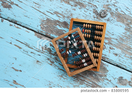 Vintage wooden abacus on old board surface. 83800595