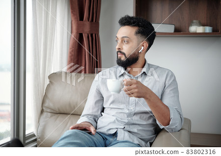 Pensive Man Drinking Coffee Pensive Man Drinking Coffee 83802316