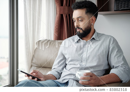 Man Answering Text Messages Man Answering Text Messages 83802318