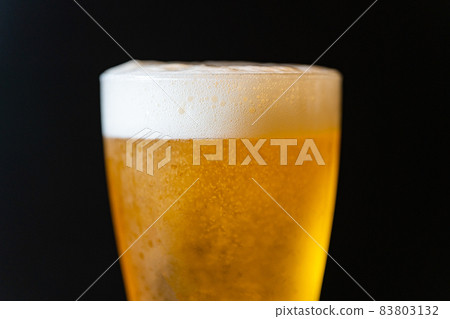 Beer poured into a glass Beer poured into a glass 83803132