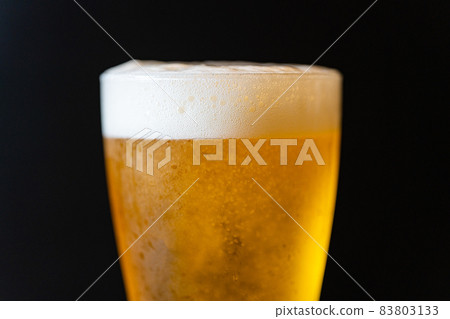 Beer poured into a glass Beer poured into a glass 83803133
