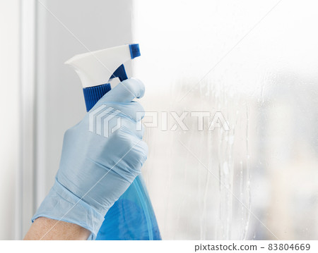 woman cleaning window. High quality beautiful photo concept 83804669