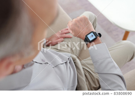 Man Using Application on Smart Watch 83808690