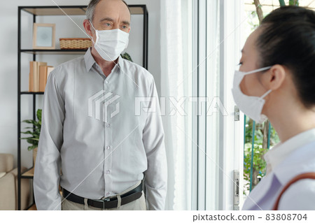 Senior Man Talking to Doctor 83808704