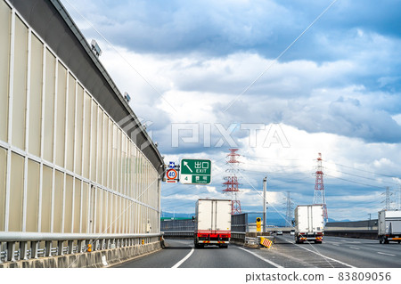 Truck approaching the exit of Toyoake interchange in Aichi prefecture Truck approaching the exit of Toyoake interchange in Aichi prefecture 83809056