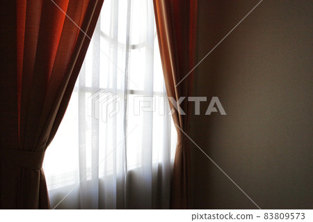 Curtain by the window where the sun shines Curtain by the window where the sun shines 83809573