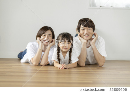 Portrait of a family of three with a smile Portrait of a family of three with a smile 83809606