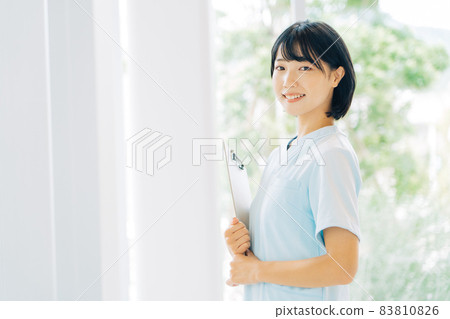 Smiling female nurse Smiling female nurse 83810826
