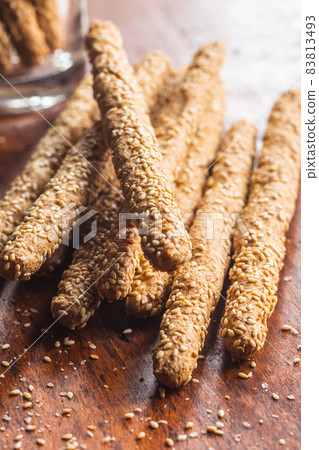 Breadsticks grissini. Bread sticks with sesame seeds. Breadsticks grissini. Bread sticks with sesame seeds. 83813493