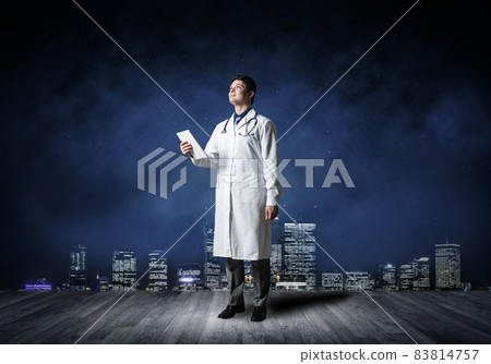 Doctor with a computer tablet Doctor with a computer tablet 83814757