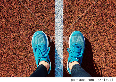 Blue sport sjoes at stadium track Blue sport sjoes at stadium track 83815941