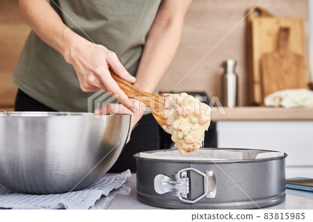 Woman cooking cake at kitchen Woman cooking cake at kitchen 83815985