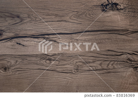 Nature material. Close up shot of wooden board with dark cracks. Abstract background or texture 83816369