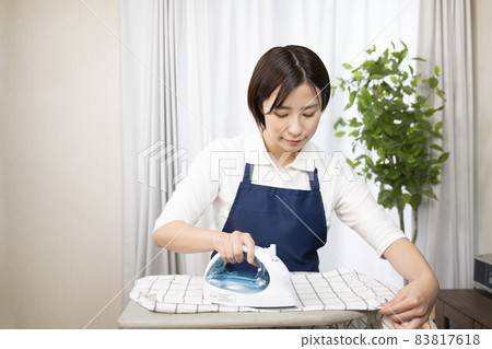 Woman ironing housekeeper Woman ironing housekeeper 83817618