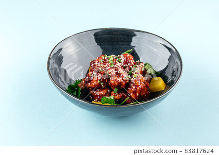 Asian marinated chicken in spicy sauce with daikon Asian marinated chicken in spicy sauce with daikon 83817624