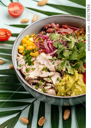 Hawaiian chicken poke bowl with rice and vegetable Hawaiian chicken poke bowl with rice and vegetable 83817656