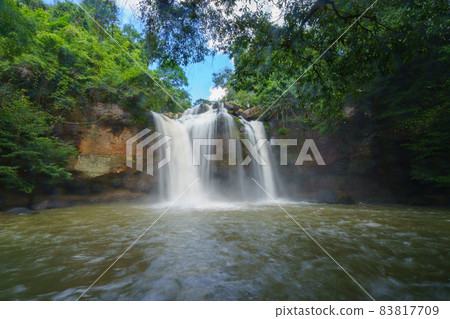 Beautiful waterfall with sunlight in jungle, Haew Suwat Waterfall at khao yai Nakhonratchasima province Beautiful waterfall with sunlight in jungle, Haew Suwat Waterfall at khao yai Nakhonratchasima province 83817709