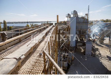 Factory with industrial facilities and buildings under blue sky Factory with industrial facilities and buildings under blue sky 83820438