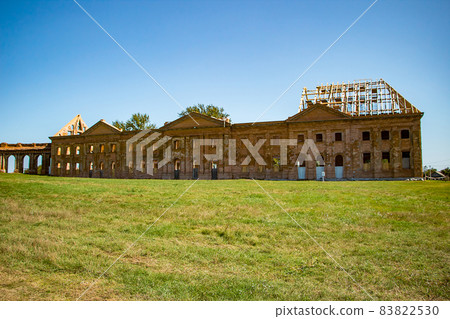 The ruins of an old abandoned medieval palace with columns in Ruzhany. Brest region, Belarus. 83822530
