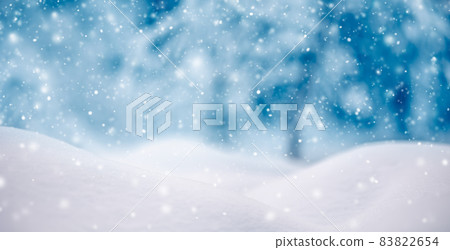 Snowy background with closeup view of the wavy snowdrifts in snowfall. 83822654