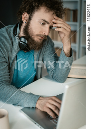 Businessman, Online Store Owner, Analyzes How to Increase Sales. Man Improving Business Sales Strategies in a Pandemic. Close-up 83822658