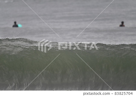 Wave surfing typhoon 83825704