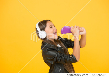 kid in headset. small girl sing favorite song. imagine  83826508