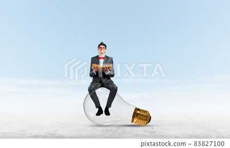 young businessman with a book young businessman with a book 83827100