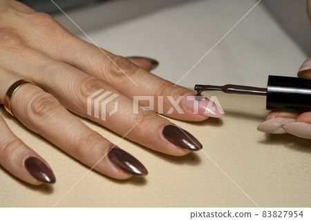 Woman doing manicure for herself. High quality photo 83827954