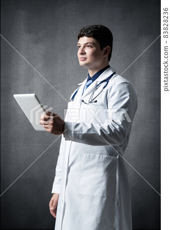 Doctor with a computer tablet Doctor with a computer tablet 83828236