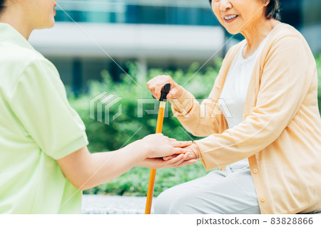 Senior women and young care helpers shooting cooperation "LINK FOREST" 83828866