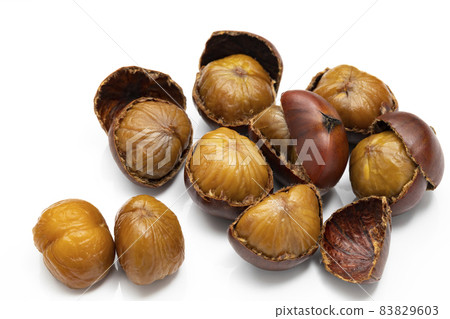Sweet chestnuts with shells on a white background 83829603