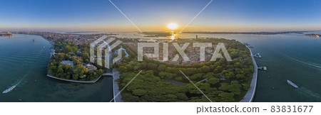 Aerial panorama of the lagoon of Venice and Lido island during sunrise Aerial panorama of the lagoon of Venice and Lido island during sunrise 83831677