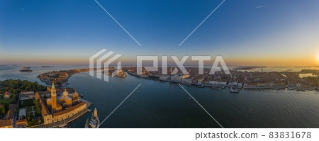 Aerial panorama of the lagoon of Venice and Lido island during sunrise Aerial panorama of the lagoon of Venice and Lido island during sunrise 83831678