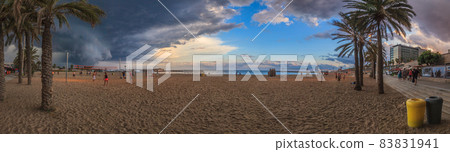 Upcoming thunderstorm at city beach in Barcelona 83831941