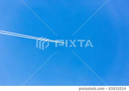 Two engined airplane during flight in high altitude with condensation trails Two engined airplane during flight in high altitude with condensation trails 83832014
