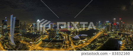 Aerial panoramic picture of Singapore skyline and gardens by the bay during preparation for Formula 1 race in the night in autumn Aerial panoramic picture of Singapore skyline and gardens by the bay during preparation for Formula 1 race in the night in autumn 83832160