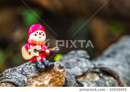 Santa Claus playing the guitar Santa Claus playing the guitar 83836945
