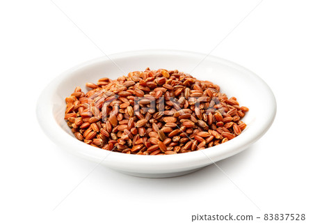Red rice on a small plate Red rice on a small plate 83837528