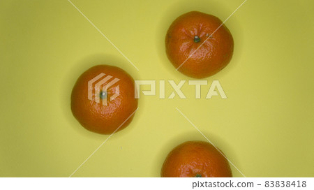 Tangerines on a yellow background, citrus subject photography Tangerines on a yellow background, citrus subject photography 83838418