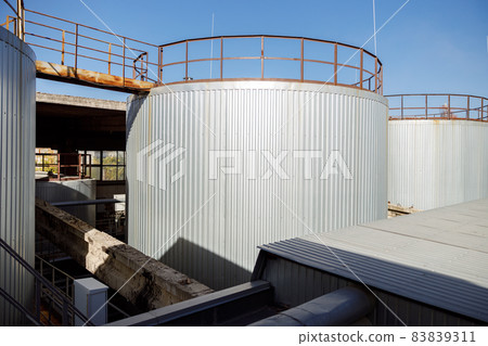 Huge steel storage containers outdoors at factory Huge steel storage containers outdoors at factory 83839311