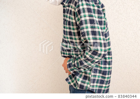 Middle man suffers from abdominal pain Middle man suffers from abdominal pain 83840344
